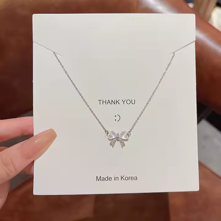 elegant bow necklace with crystal accent